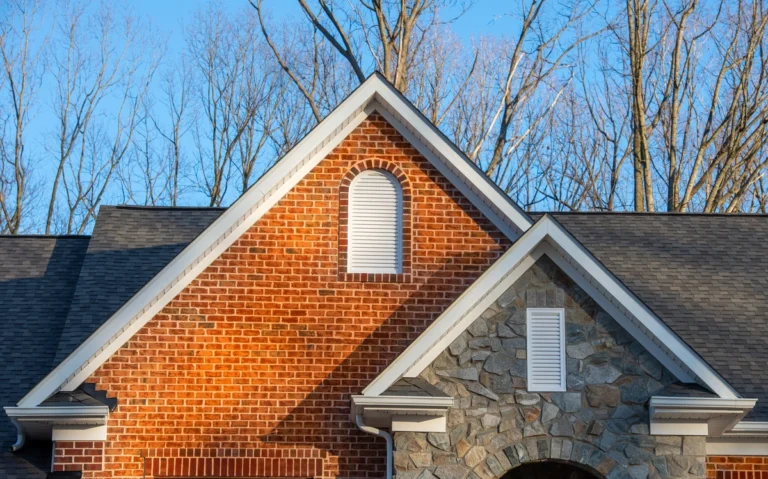 beautiful brick home with gable types of roof vents to best ventilation